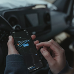 an individual looking at the GPS on a cellular device